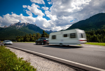 Family vacation travel, holiday trip in motorhome RV, caravan car motion blur