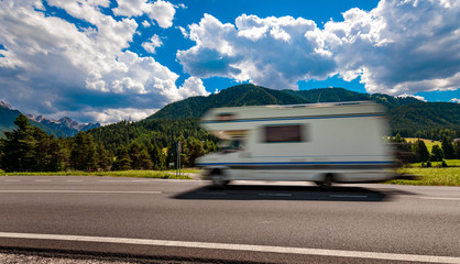 Family vacation travel, holiday trip in motorhome RV, caravan car motion blur