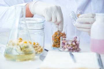 Chemist mixing perfumes in the lab