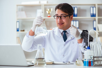 Young researcher scientist doing a water test contamination expe