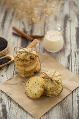 Sesame Cookies, sesame and milk on black wooden background