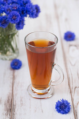 A cup of tea and flowers