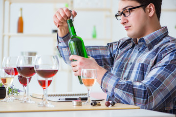 Professional sommelier tasting red wine 