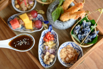 Set of Thai appetizer in a tray and tamarind sauce