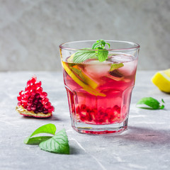 Holiday cranberry pomegranate mojito. Selective focus, space for text.