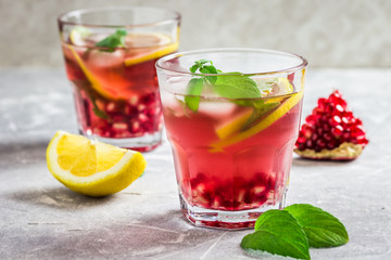 Delicious omegranate mojito. Selective focus, space for text.