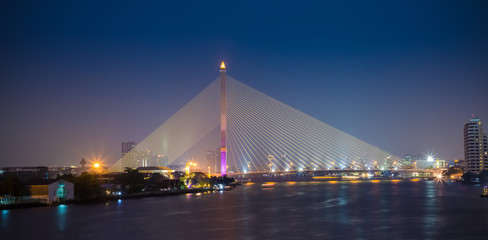 Fototapeta na wymiar Thailand bangkok night cable bridge ( Rama VIII Bridge ) The Rama VIII Bridge is a cable-stayed bridge crossing the Chao Phraya River in Bangkok Thailand