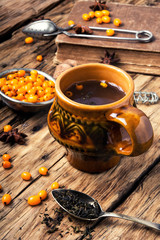 Obraz na płótnie Canvas healthy tea with sea-buckthorn