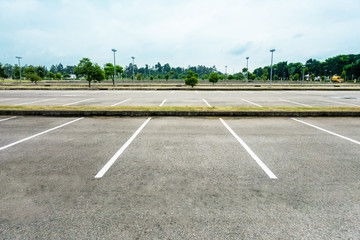 Empty parking with white line mark on rainy cloudy day