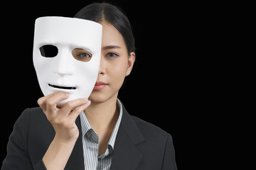 White mask with a businesswoman wearing a suit, concept, spying or ambiguous - 174952305