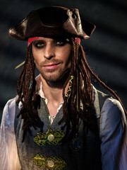 Portrait of a young man in a pirate costume.