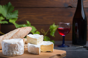 variation of cheese and wine and bread