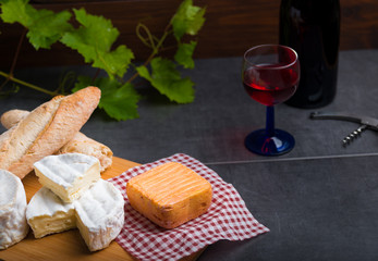 variation of cheese and wine and bread