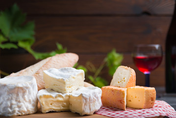 variation of cheese and wine and bread
