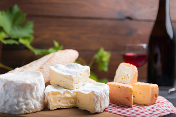 variation of cheese and wine and bread