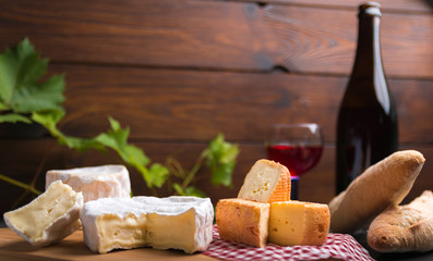 variation of cheese and wine and bread