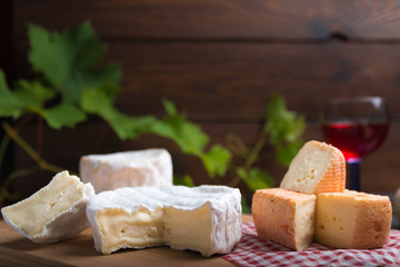 variation of cheese and wine and bread