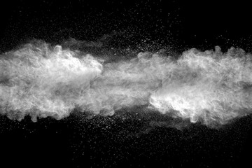 Explosion of white dust on black background.