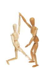 Two wooden manikins dancing