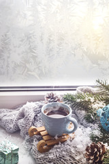 Obraz na płótnie Canvas cozy soft gray blanket with a cup of coffee