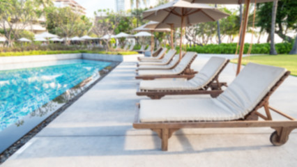 Blur background of deck chair, bed beside swimming pool 1