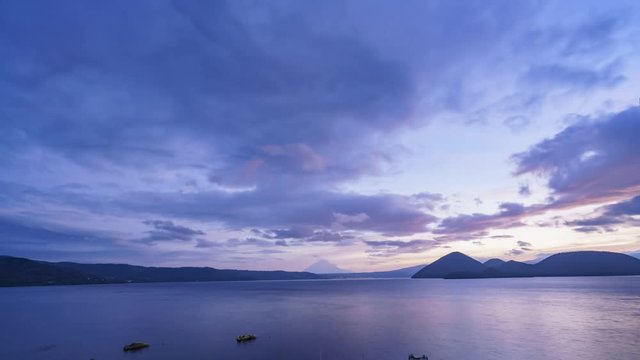 Sunrise motion timelapse of the famous Lake Toya with Mount Yotei at Hokkaido, Japan