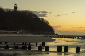 lighthouse on the coast of the Baltic sea at sunset