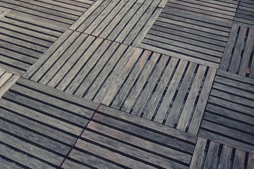 square wood decks arranged on the floor