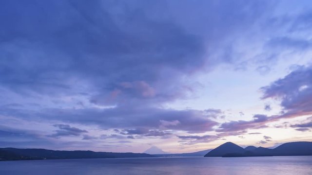 Sunrise motion timelapse of the famous Lake Toya with Mount Yotei at Hokkaido, Japan