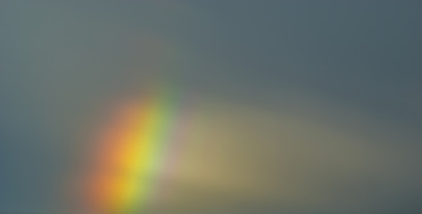 stormy sky with colorful rainbow
