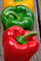 Colorful pepper on wooden background