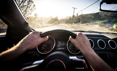 Man driving convertible car in Los angeles, santa monica