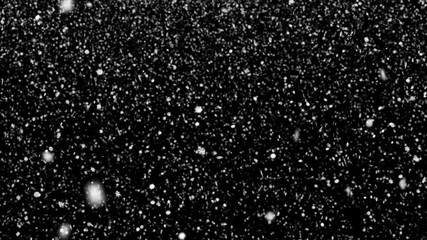 Animated realistic detailed small snow flakes slowly falling densely against black background. Shallow depth of field. Mask included.
