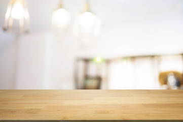 blank wooden table with blurred montage coffee shop cafe background
