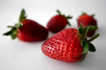 Strawberries close up on white background