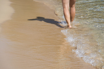view of the feet on a sea beach