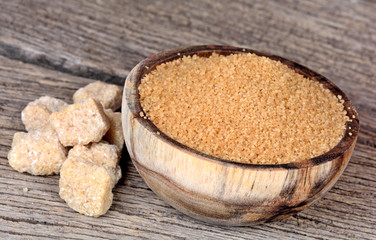 Beige sugar in a bowl and table