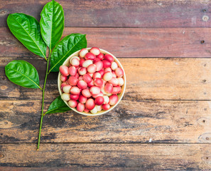 Karanda in a bowl on wooden background with Copy space