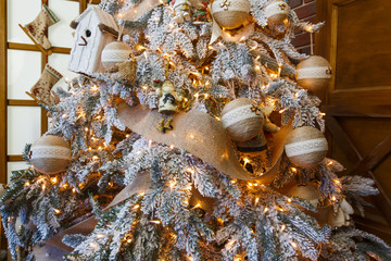 Beatiful christmas decorated tree in shining lights