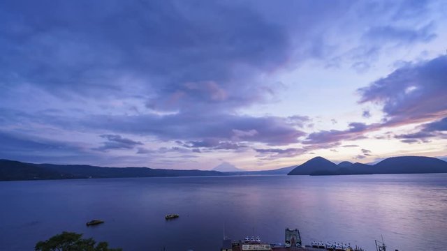 Sunrise motion timelapse of the famous Lake Toya with Mount Yotei at Hokkaido, Japan
