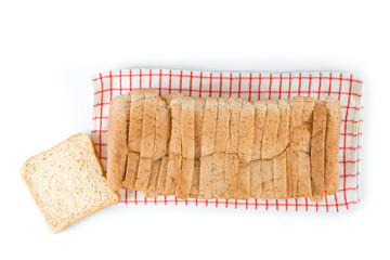 Fresh bread sliced on towel., white background..Whole wheat and organic ingredient bread,healthy eating concept.