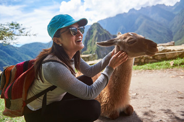 Smiling tourist woman with lama © PixieMe