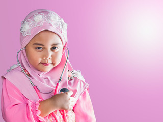 happy muslim girl with full hijab in pink dress