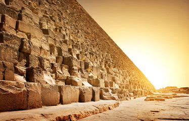 Fiery sunset and pyramid