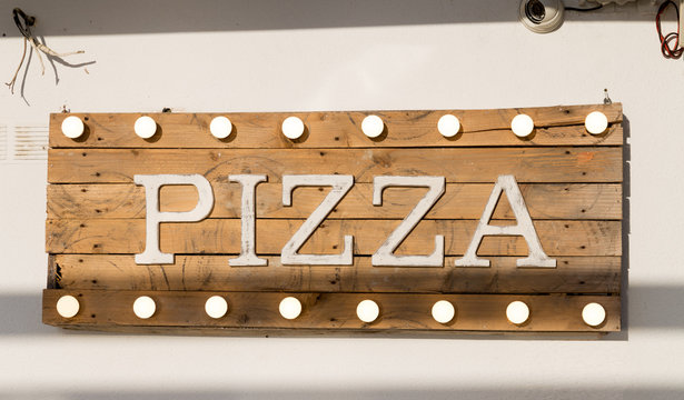 Rustic wooden pizza sign