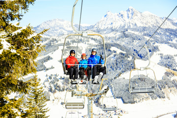 Fototapeta na wymiar Family Riding In The Ski Lift