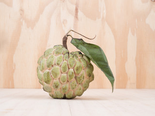 close up shot of custard apple, sweet fruits on wooden background
