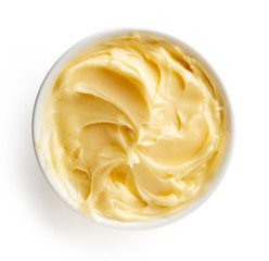 Bowl of butter on white background