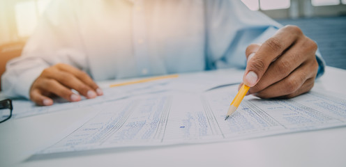 Image of financial worker analyzing statistical data,Financial business concept