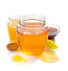 variety of honey in jar white background